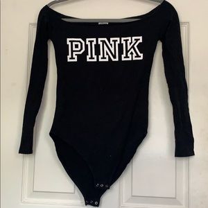 A pink black bodysuit
